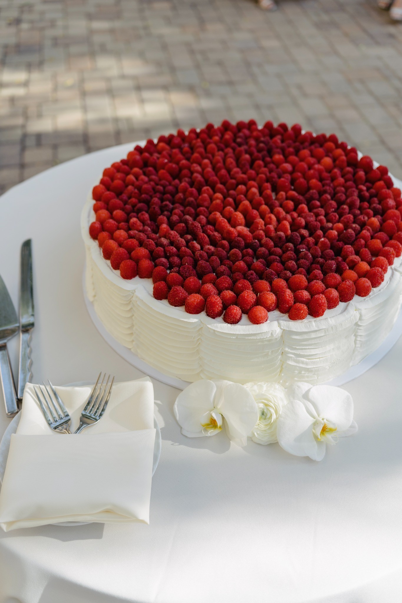 Wedding cake topped with red berries